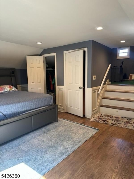 2837 Myrtle Terrace Linden, NJ 07036 - Photo 13 of 15 a spacious bedroom with a large bed and a chandelier