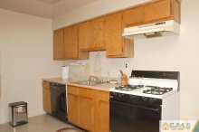 1425 Raspberry Court Edison, NJ 08817 - Photo 4 of 8 a kitchen with stainless steel appliances granite countertop a sink stove and refrigerator