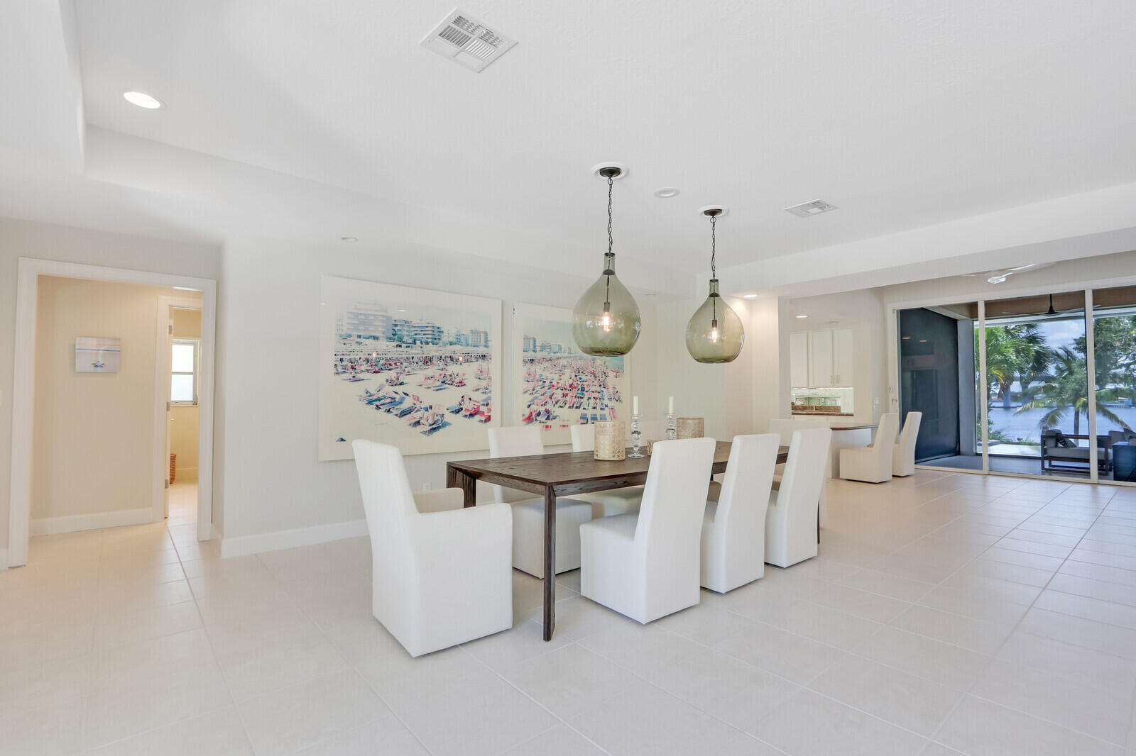 11 North River Road Sewall's Point, FL 34996 - Photo 14 of 67 a view of a dining room with furniture and chandelier