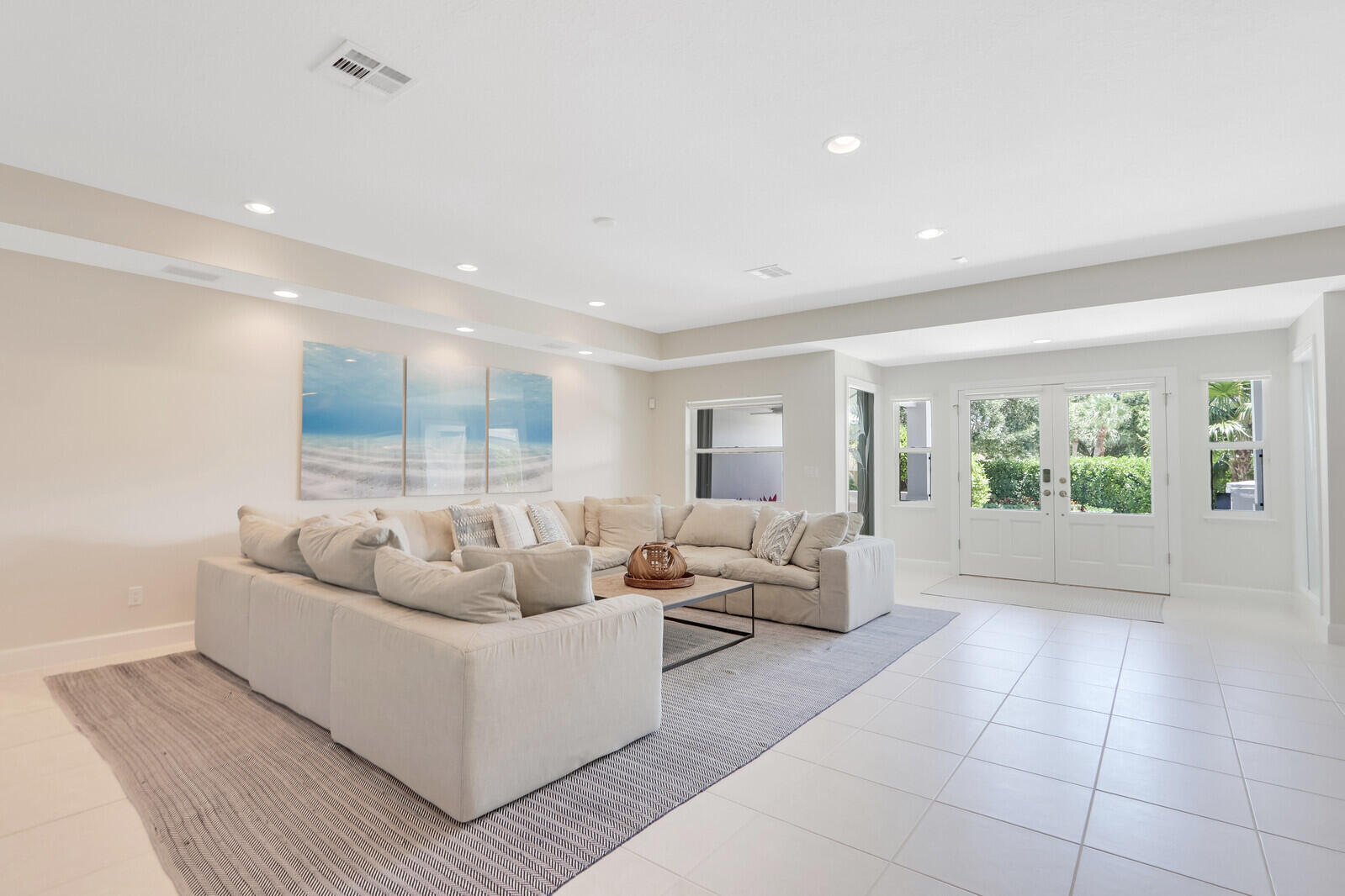 11 North River Road Sewall's Point, FL 34996 - Photo 16 of 67 a living room with furniture and a large window