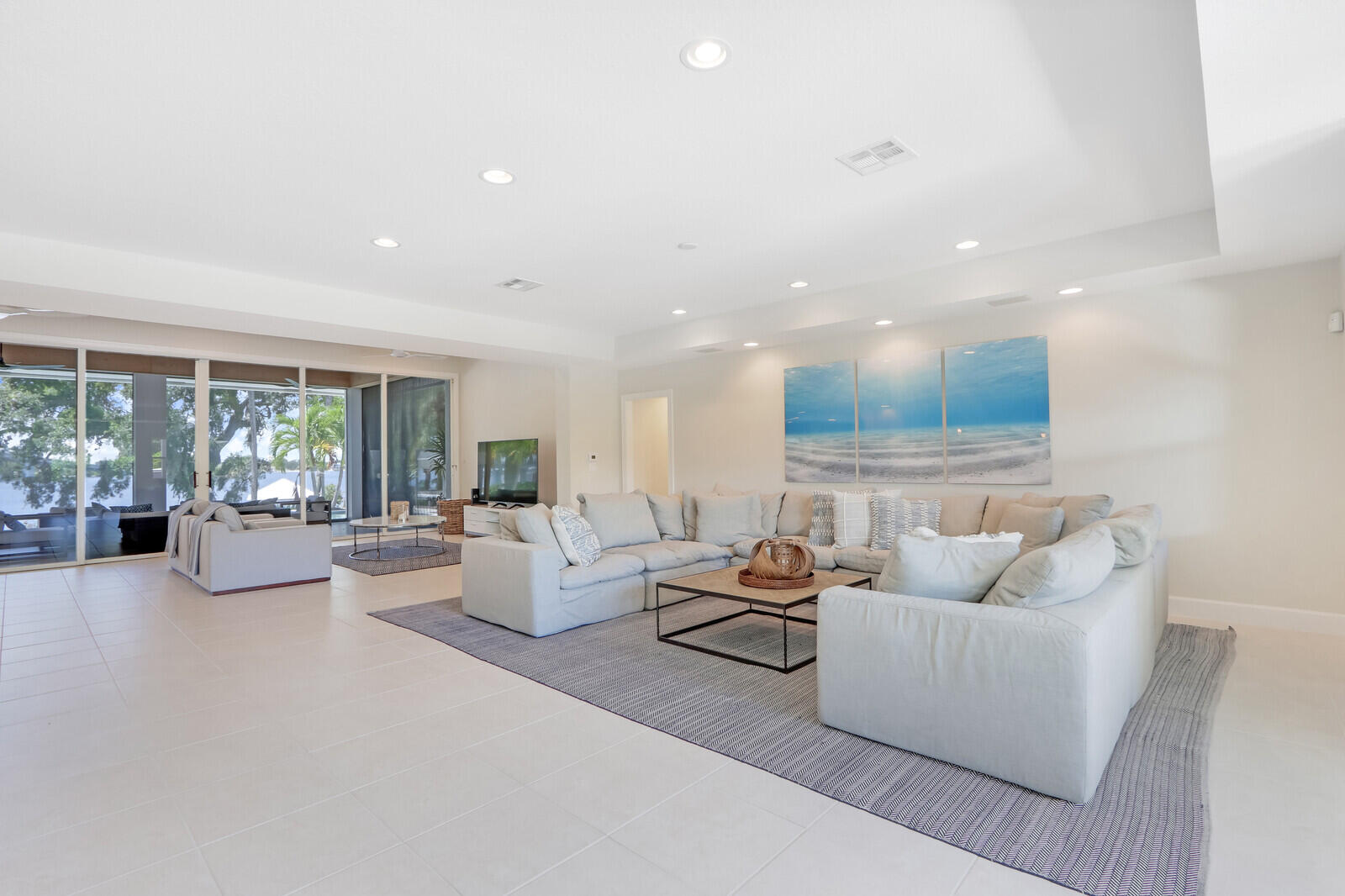 11 North River Road Sewall's Point, FL 34996 - Photo 17 of 67 a living room with furniture and a large window