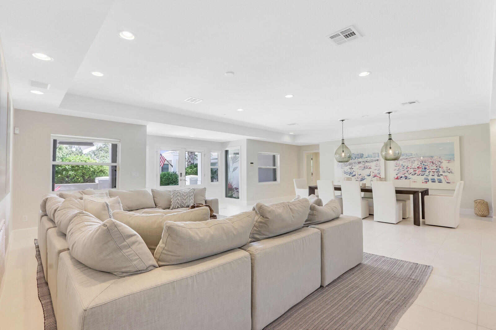 11 North River Road Sewall's Point, FL 34996 - Photo 19 of 67 a living room with furniture and a large window