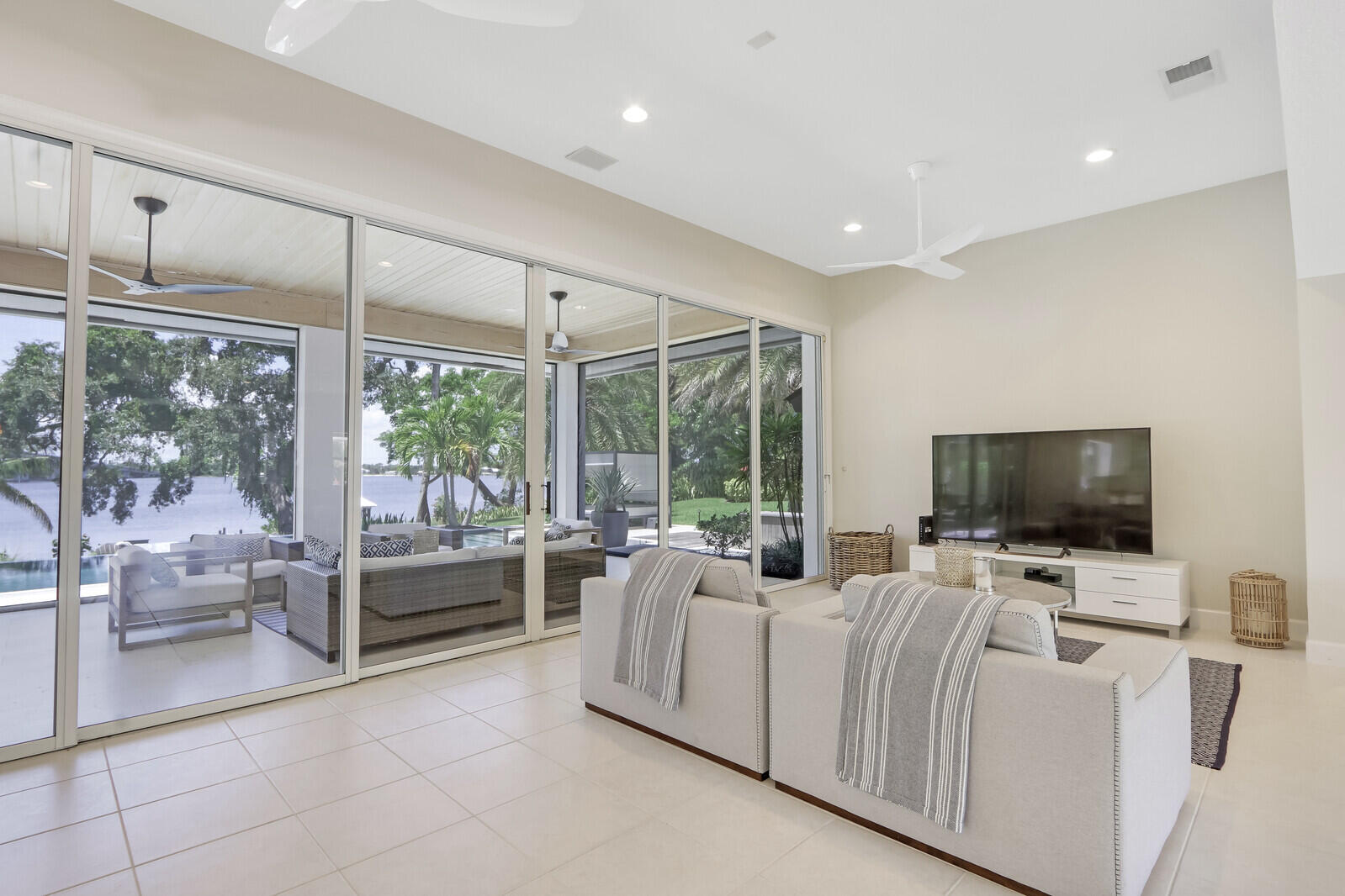 11 North River Road Sewall's Point, FL 34996 - Photo 21 of 67 a living room with furniture and large flat screen tv