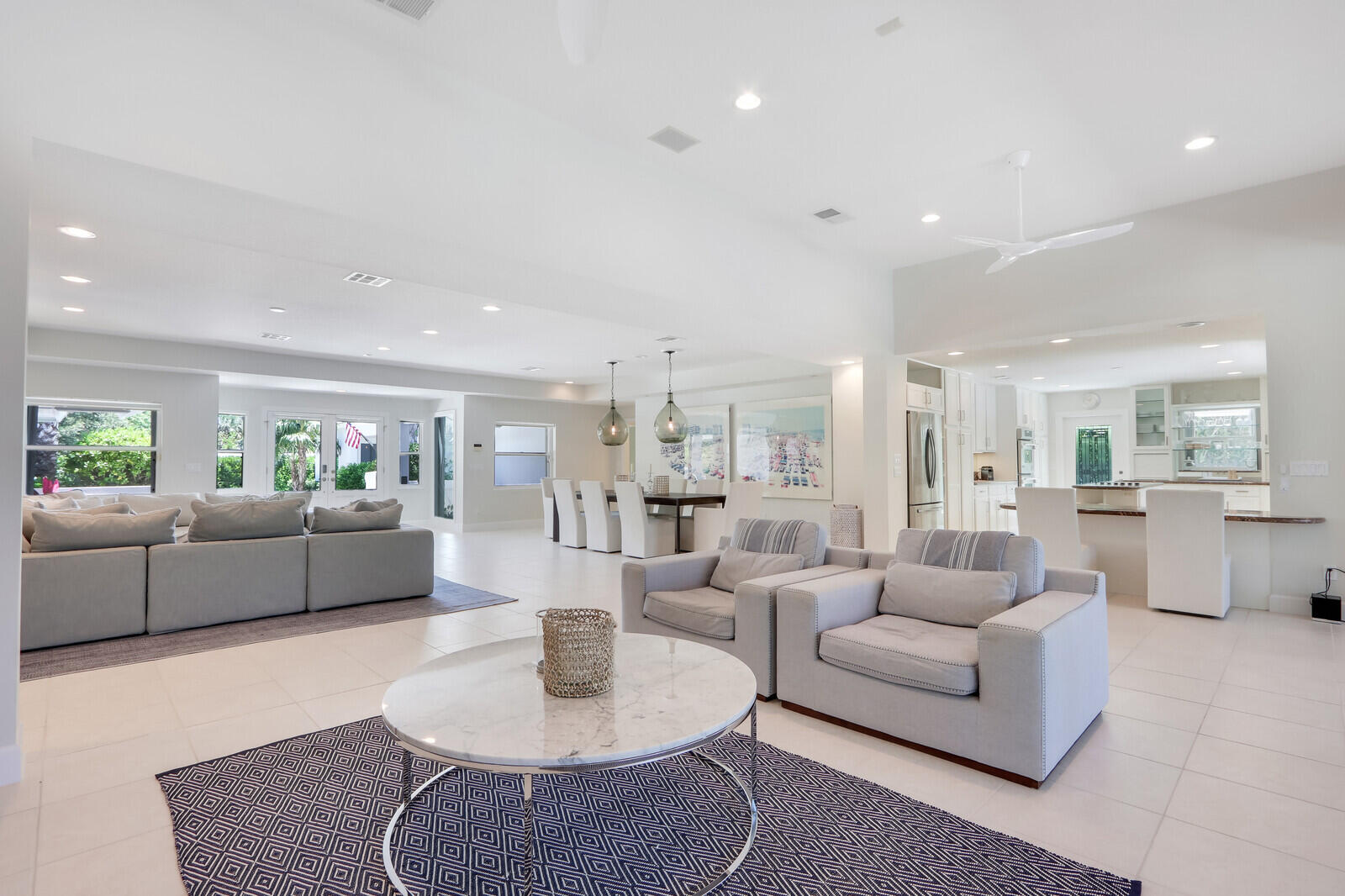 11 North River Road Sewall's Point, FL 34996 - Photo 22 of 67 a living room with furniture kitchen view and a table