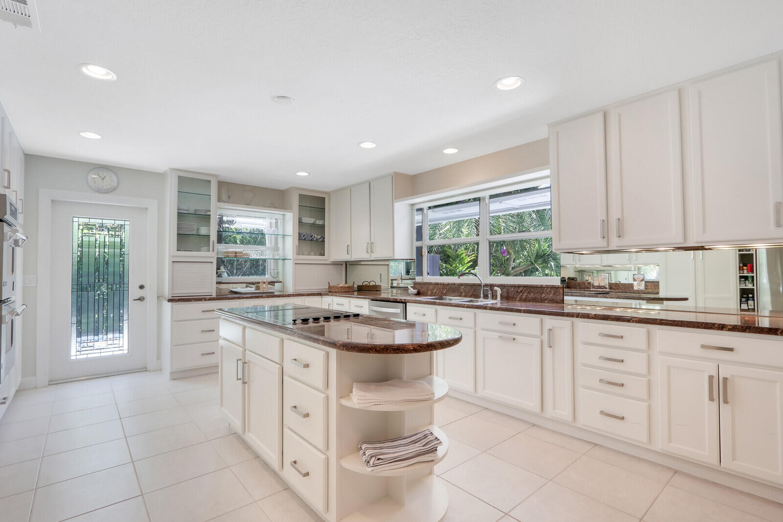 11 North River Road Sewall's Point, FL 34996 - Photo 24 of 67 a kitchen with sink cabinets and window
