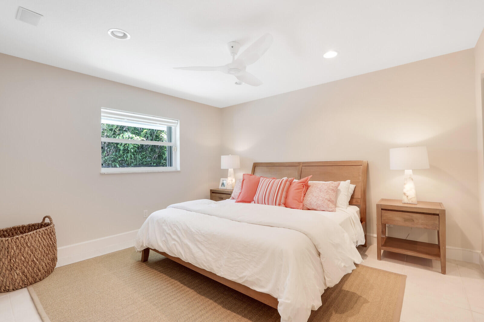 11 North River Road Sewall's Point, FL 34996 - Photo 29 of 67 a bedroom with a bed and a couch