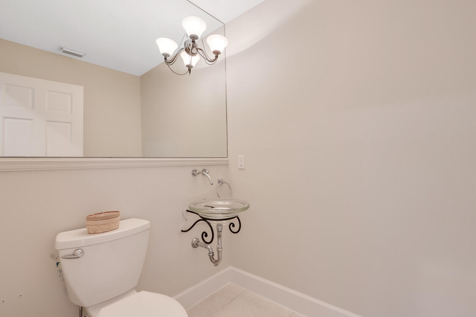 11 North River Road Sewall's Point, FL 34996 - Photo 32 of 67 a bathroom with a toilet sink and mirror