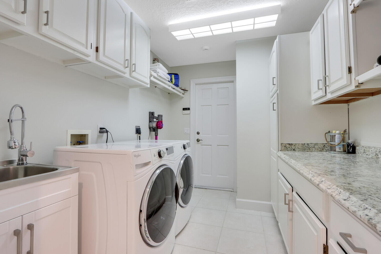 11 North River Road Sewall's Point, FL 34996 - Photo 33 of 67 a utility room with dryer and washer