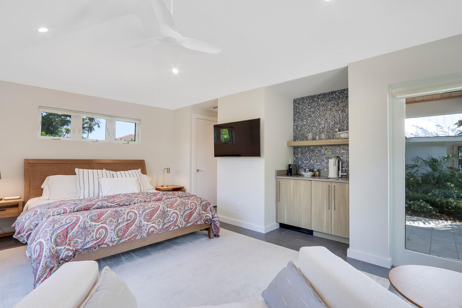 11 North River Road Sewall's Point, FL 34996 - Photo 44 of 67 a bedroom with a bed and a couch