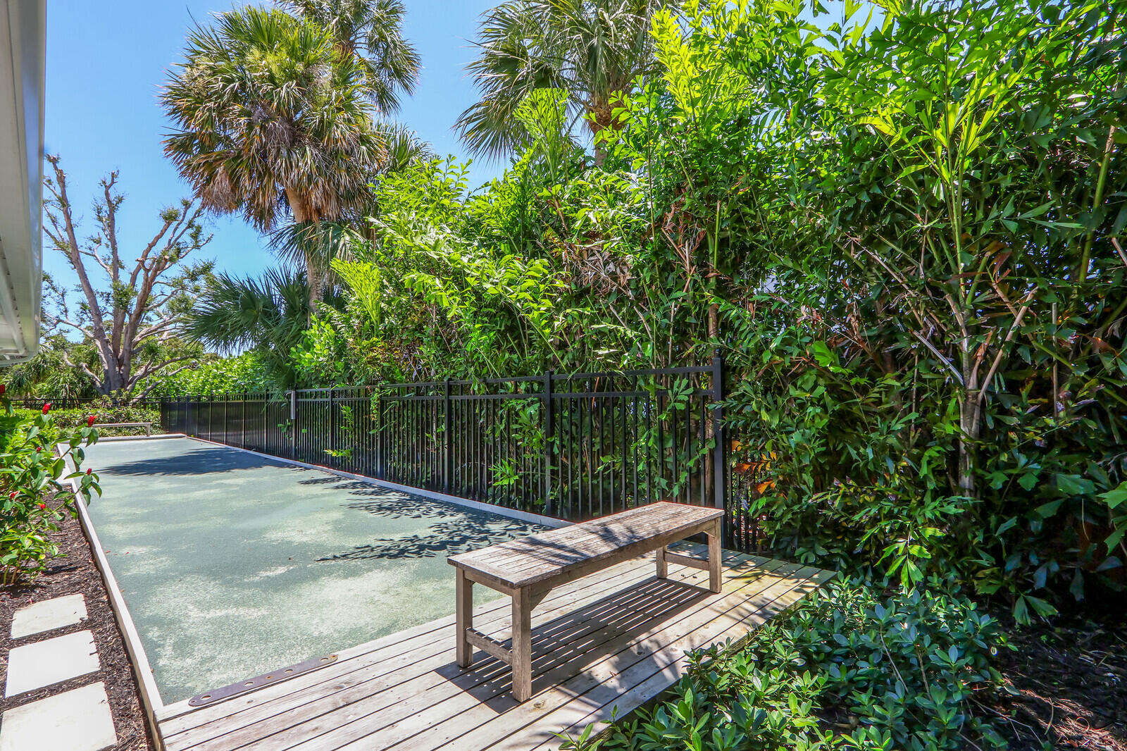 11 North River Road Sewall's Point, FL 34996 - Photo 51 of 67 a view of a bench in a backyard