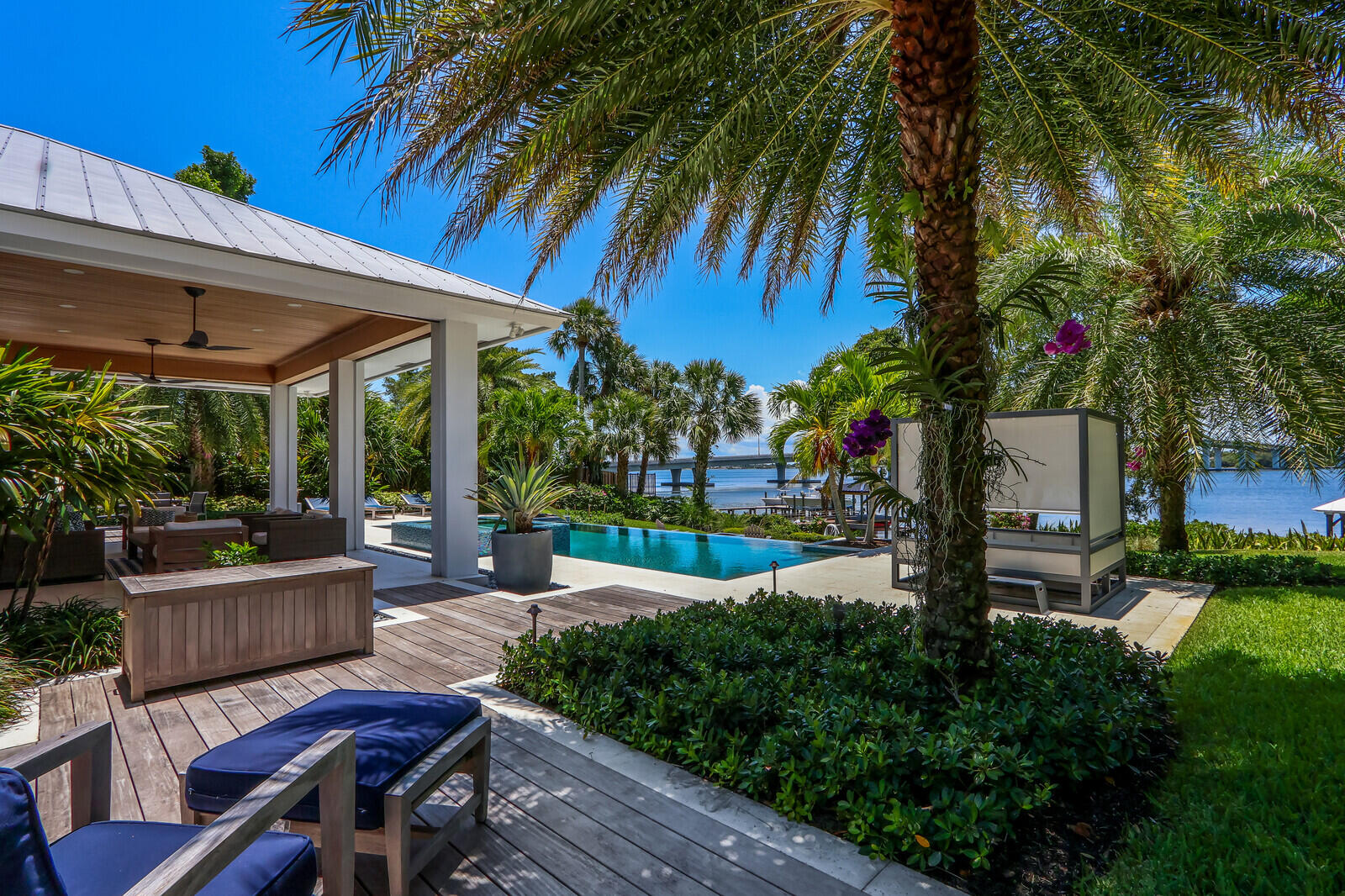 11 North River Road Sewall's Point, FL 34996 - Photo 56 of 67 a view of a backyard with plants and a patio