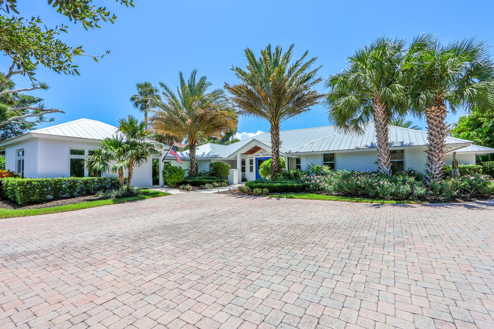 11 North River Road Sewall's Point, FL 34996 - Photo 8 of 67 a view of a palm trees in front of house