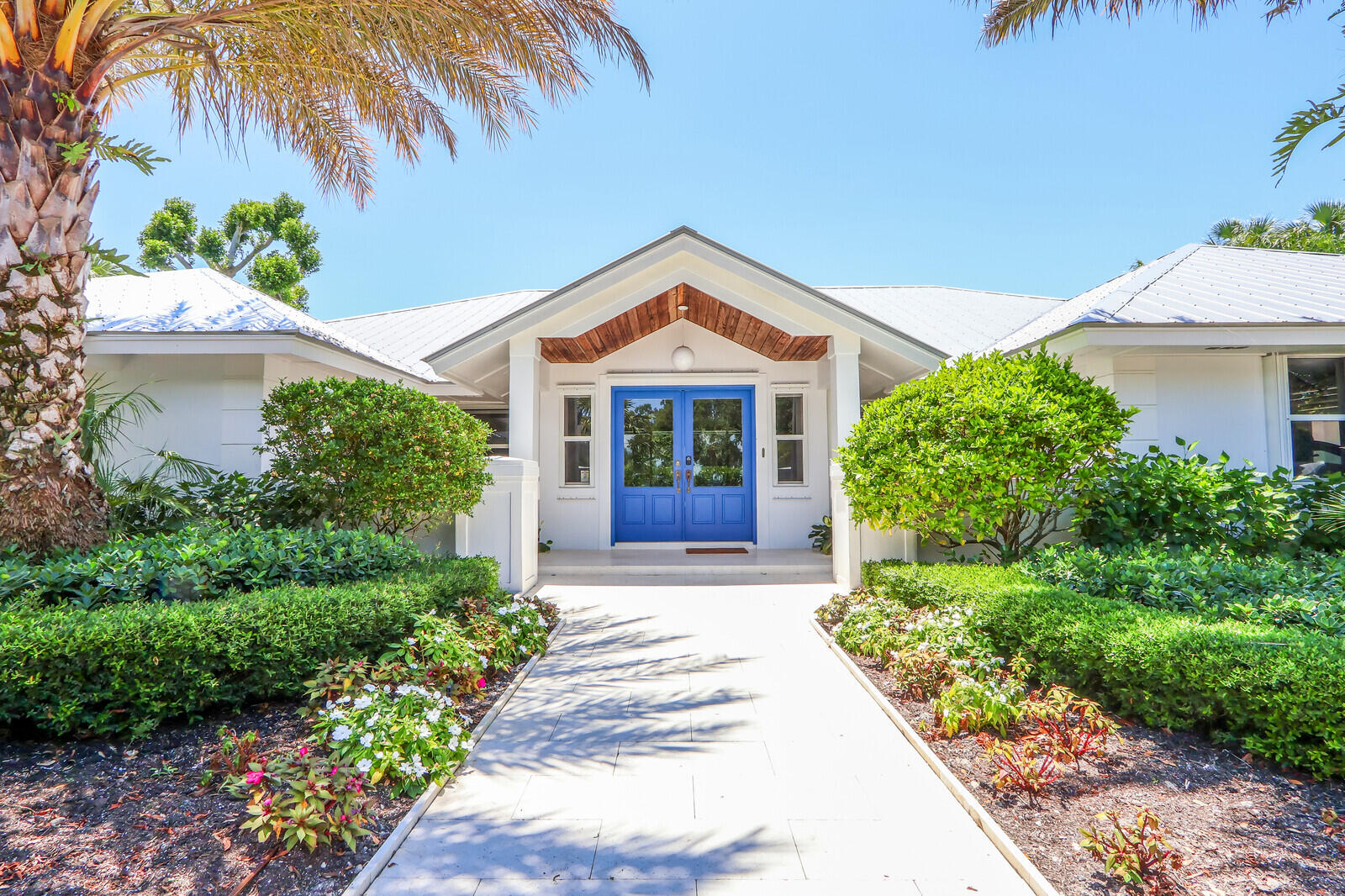 11 North River Road Sewall's Point, FL 34996 - Photo 10 of 67 a front view of a house with garden