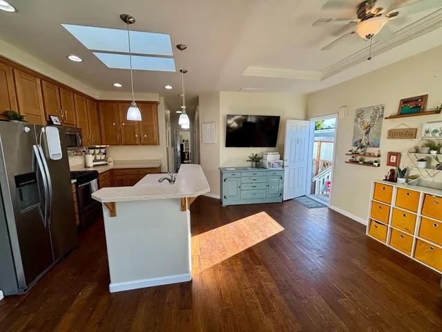 a view of kitchen with cabinets and wooden floor