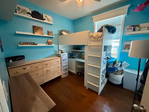 a kitchen with stainless steel appliances cabinets and a window