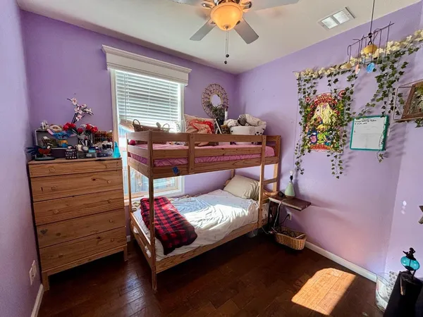 a bed room with a bed and a dresser