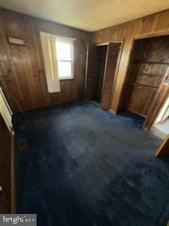17 Propeller Drive Baltimore, MD 21220 - Photo 11 of 18 a view of an empty room with wooden floor and a window