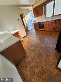 17 Propeller Drive Baltimore, MD 21220 - Photo 7 of 18 a view of washer and dryer with bathtub in a room