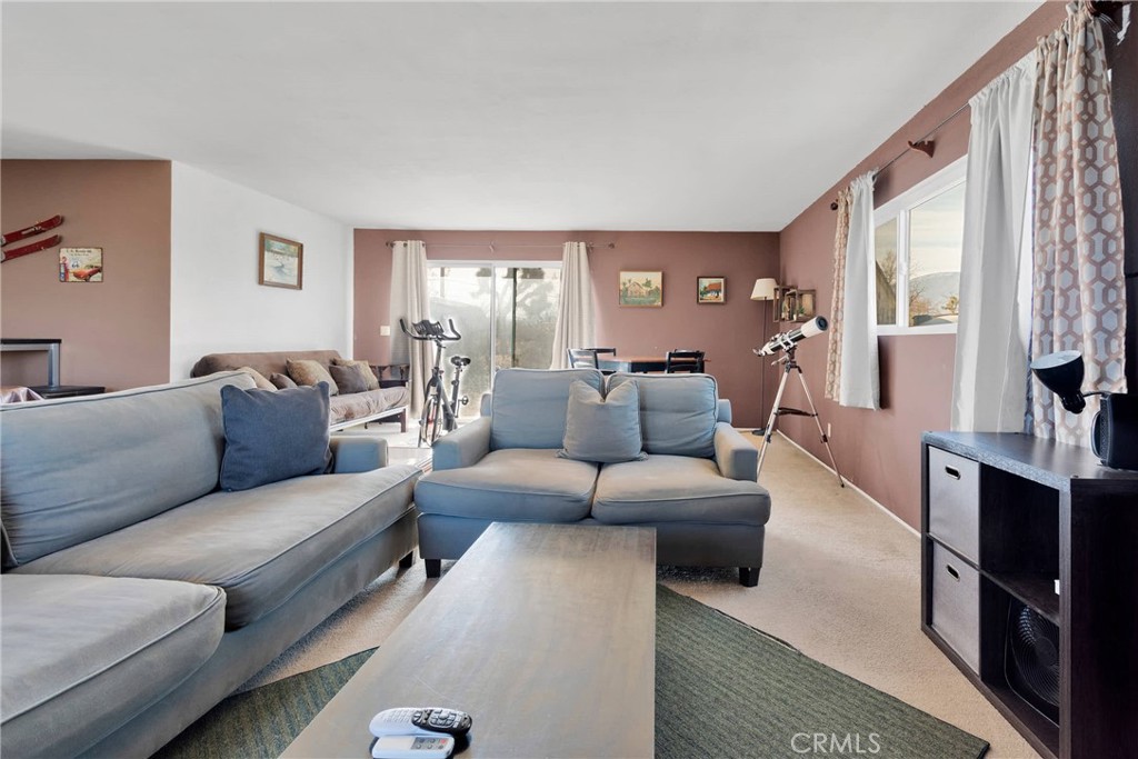 9482 Palomar Trail Lucerne Valley, CA 92356 - Photo 16 of 45 a living room with furniture and a window