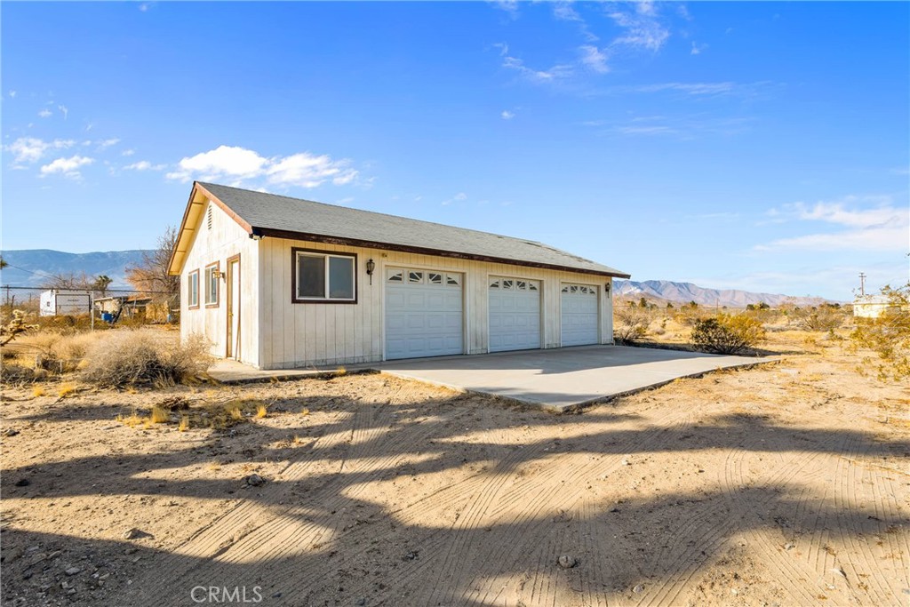 9482 Palomar Trail Lucerne Valley, CA 92356 - Photo 26 of 45 a house with trees in front of it