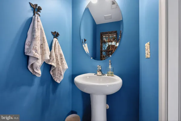 a bathroom with a sink and mirror
