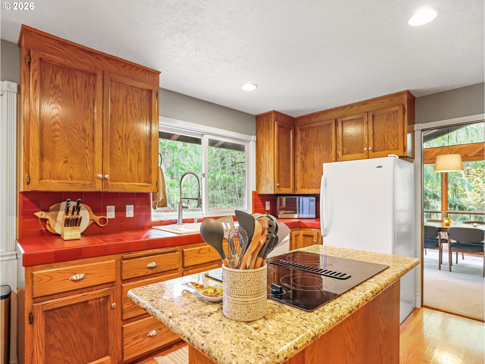 45990 Southeast Jadrny Road Sandy, OR 97055 - Photo 13 of 47 a kitchen with stainless steel appliances granite countertop a refrigerator and a stove