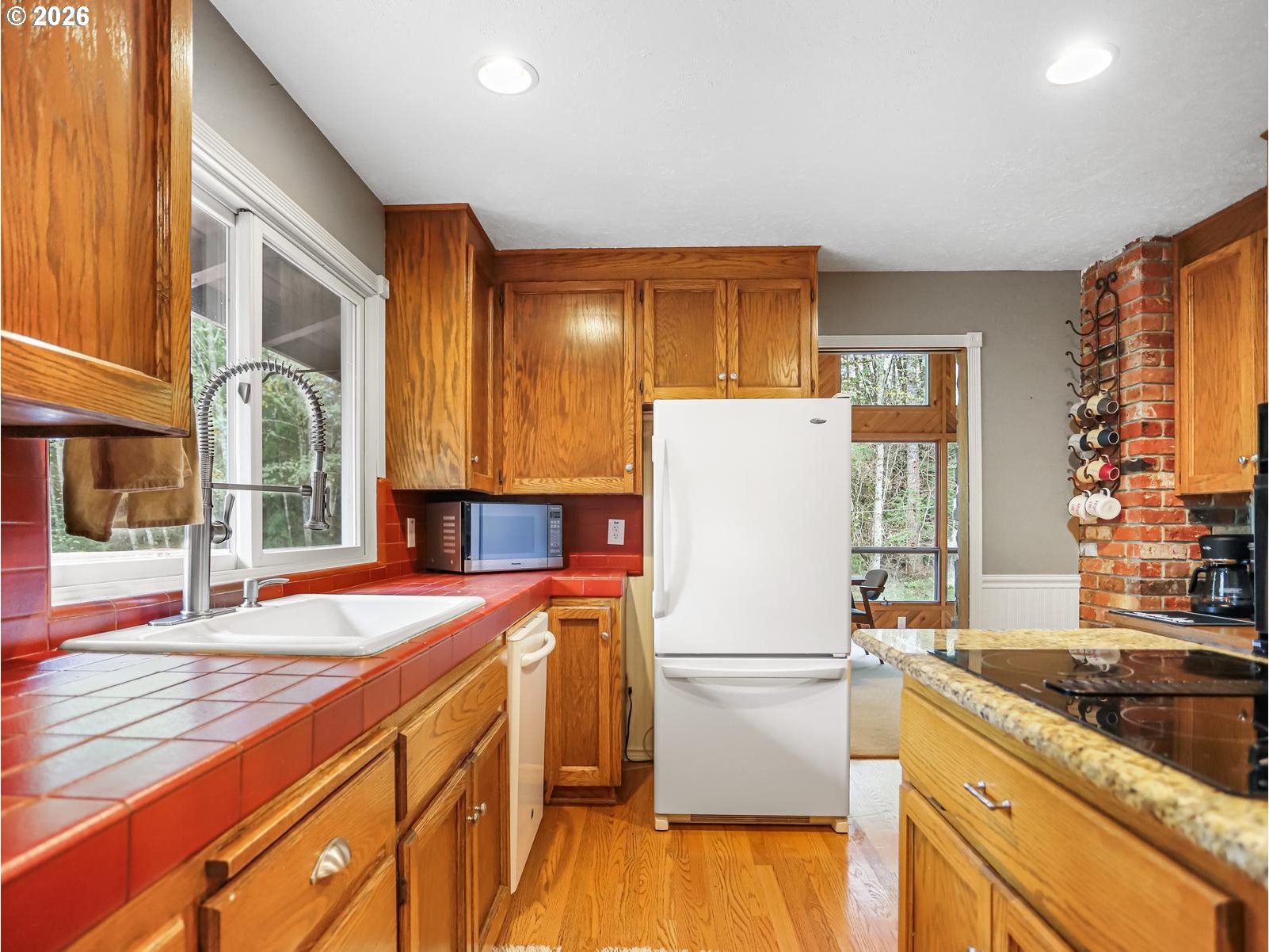 45990 Southeast Jadrny Road Sandy, OR 97055 - Photo 14 of 47 a kitchen with a refrigerator and a sink