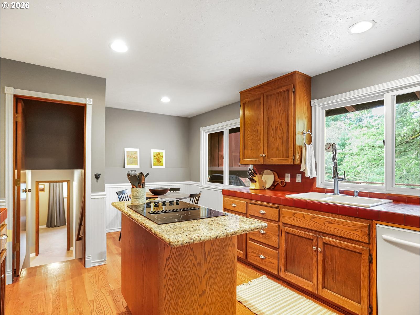 45990 Southeast Jadrny Road Sandy, OR 97055 - Photo 16 of 47 a kitchen that has a sink and a stove in it