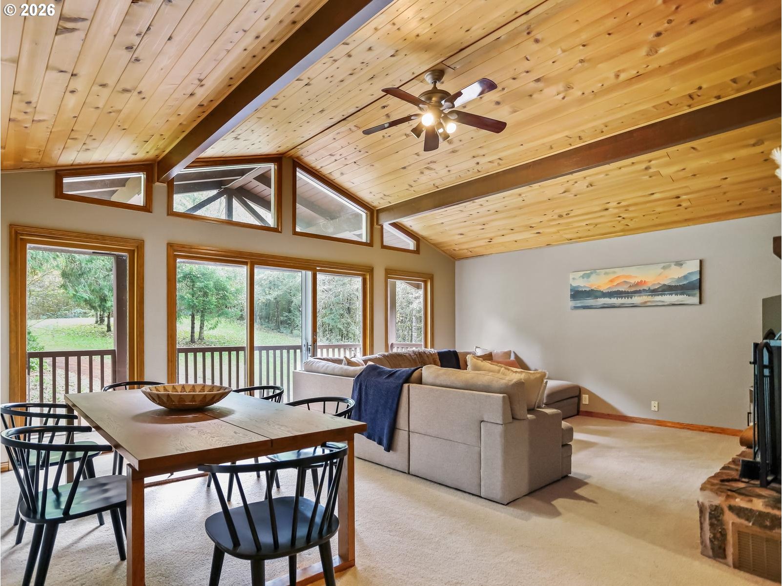 45990 Southeast Jadrny Road Sandy, OR 97055 - Photo 22 of 47 a livingroom with furniture a flat screen tv and a ceiling fan