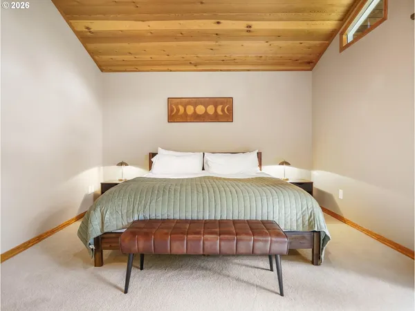 a bedroom with a bed and a table in it