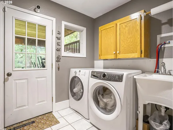 a utility room with dryer and washer