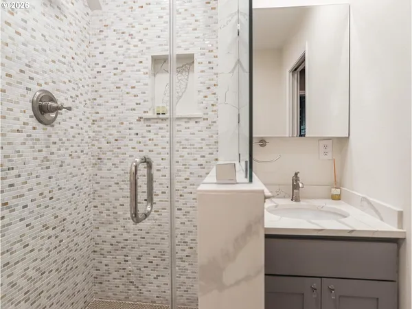 a bathroom with a sink and mirror