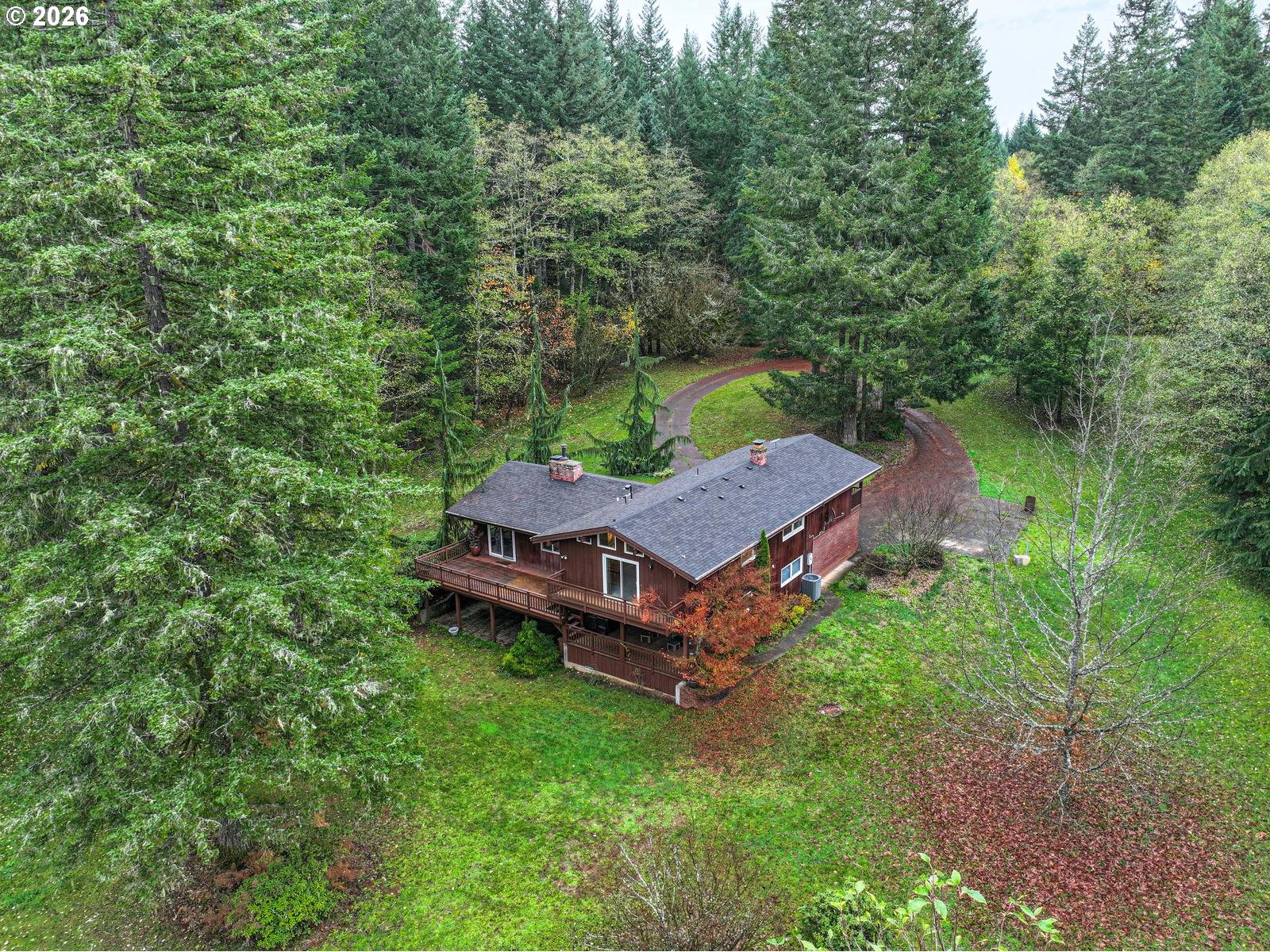 45990 Southeast Jadrny Road Sandy, OR 97055 - Photo 4 of 47 an aerial view of a house with a yard