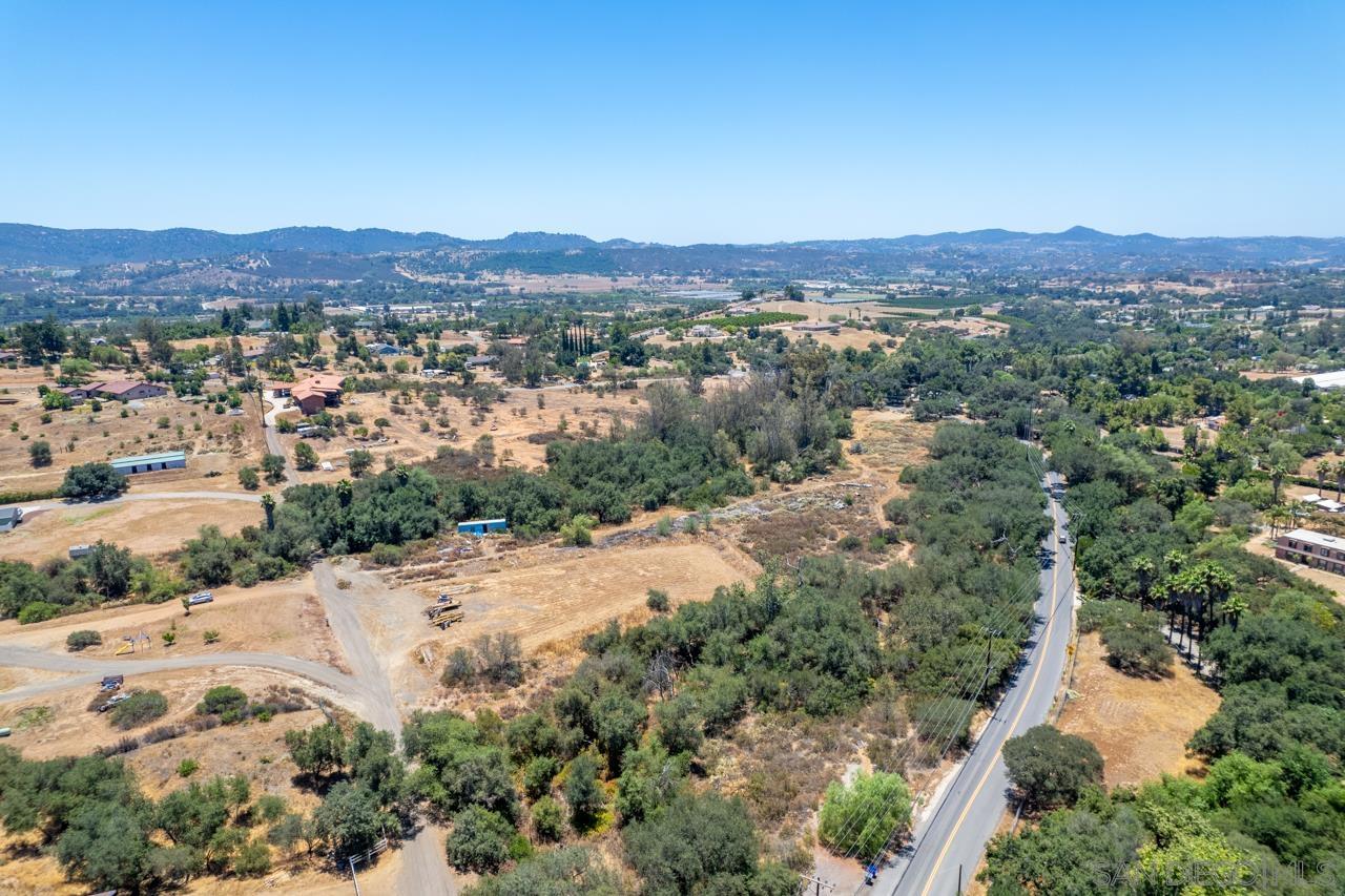 15612 Fruitvale Road Valley Center, CA 92082 - Photo 9 of 33 an aerial view of a houses with a street and green space