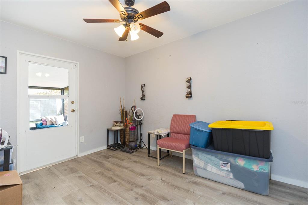 7703 Robert E Lee Road Tampa, FL 33637 - Photo 16 of 23 a living room with furniture and wooden floor