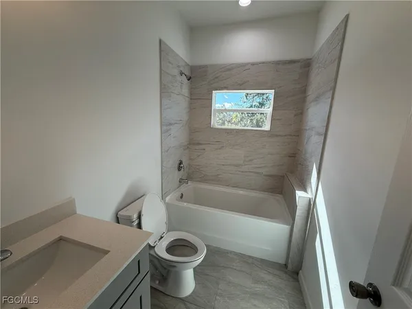 a bathroom with a sink and a bathtub