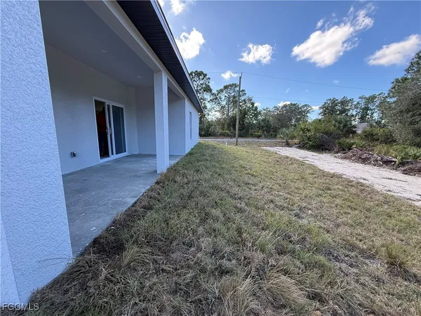 a view of a backyard of the house