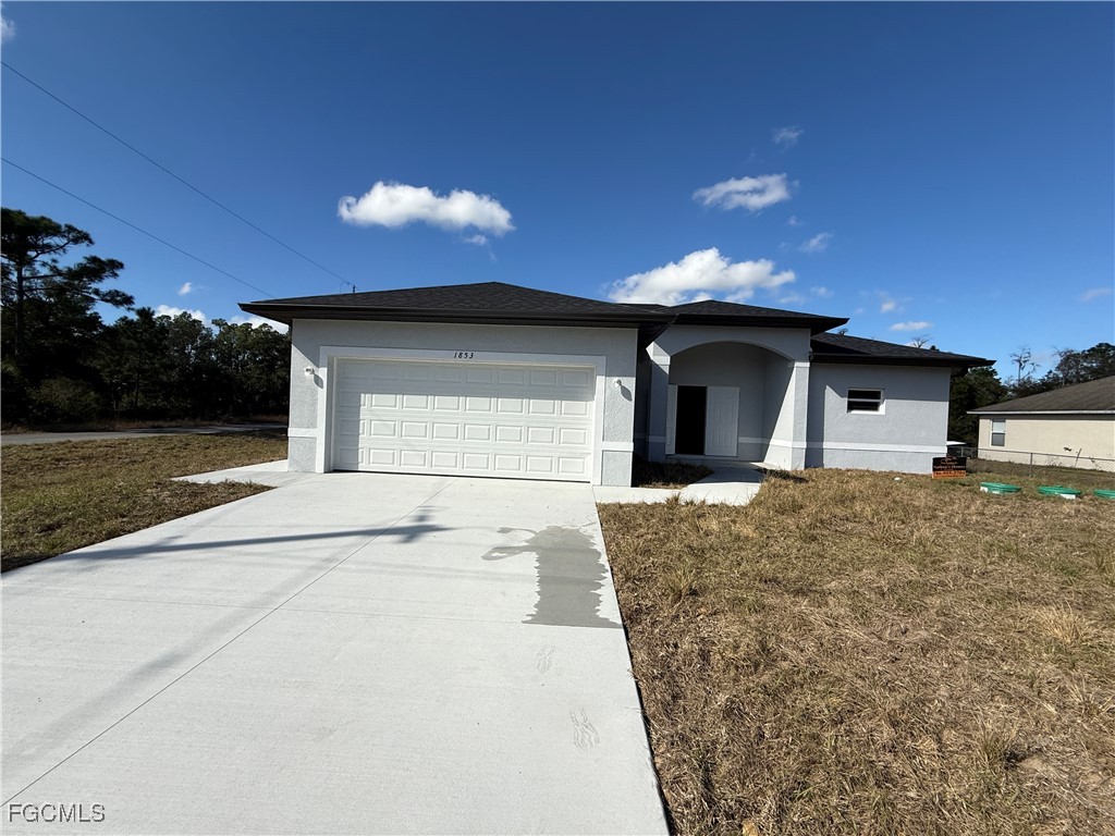 1853 Norma Court Lehigh Acres, FL 33972 - Photo 2 of 19 a house view with a outdoor space