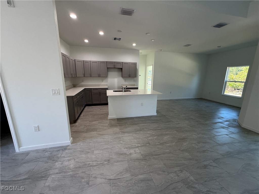 1853 Norma Court Lehigh Acres, FL 33972 - Photo 4 of 19 a view of kitchen with sink and microwave