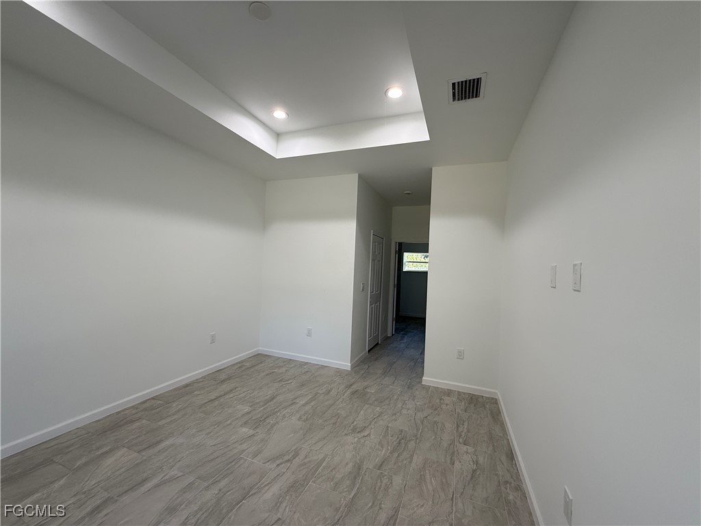 1853 Norma Court Lehigh Acres, FL 33972 - Photo 6 of 19 wooden floor in an empty room