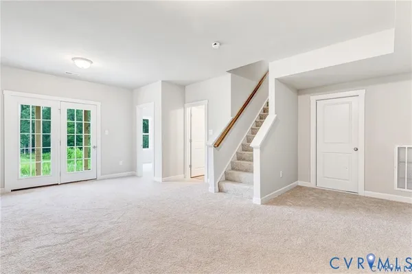 a view of an empty room with stairs