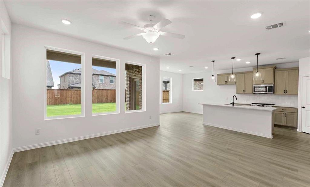 14209 Gallatin Street Pilot Point, TX 76258 - Photo 5 of 12 Open Kitchen-Living-Dining Room Representative Photo featuring the Artisan Collection
