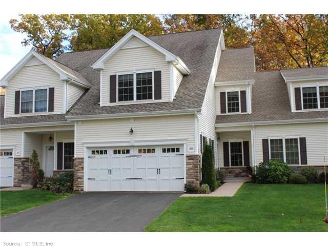 38 Brighton Park Way, Unit 38 Bloomfield, CT 06002 - Photo 1 of 1 a view of a yard in front view of a house