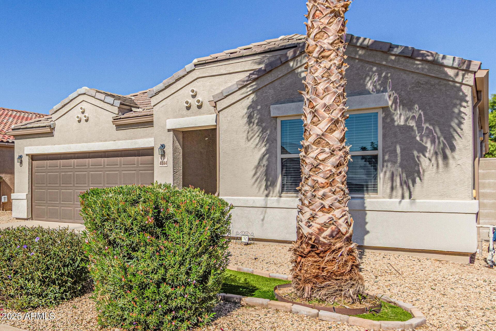 41844 West Rosa Drive Maricopa, AZ 85138 - Photo 11 of 47 front view of a house with a small yard