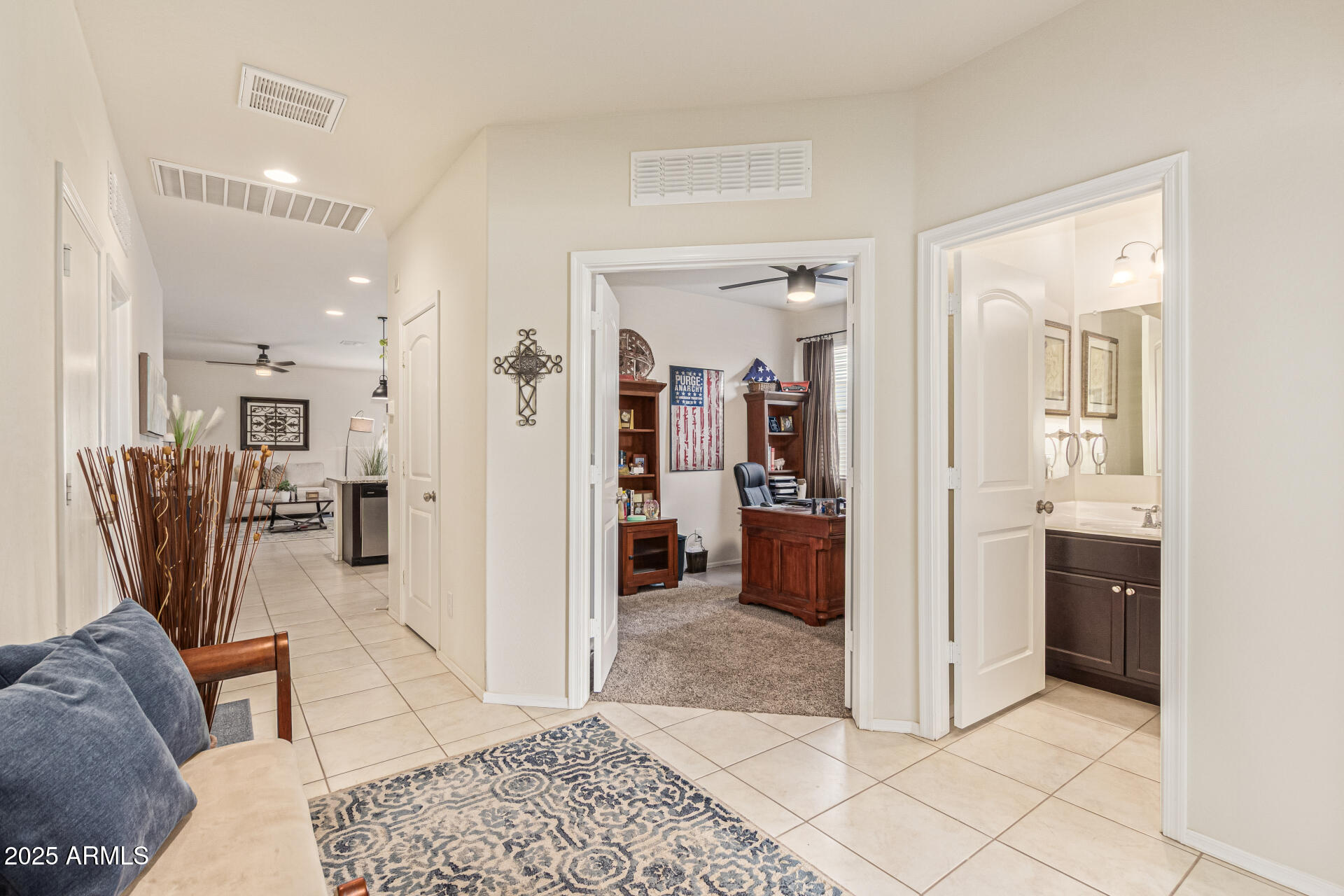 41844 West Rosa Drive Maricopa, AZ 85138 - Photo 14 of 47 a living room with furniture a flat screen tv and kitchen view