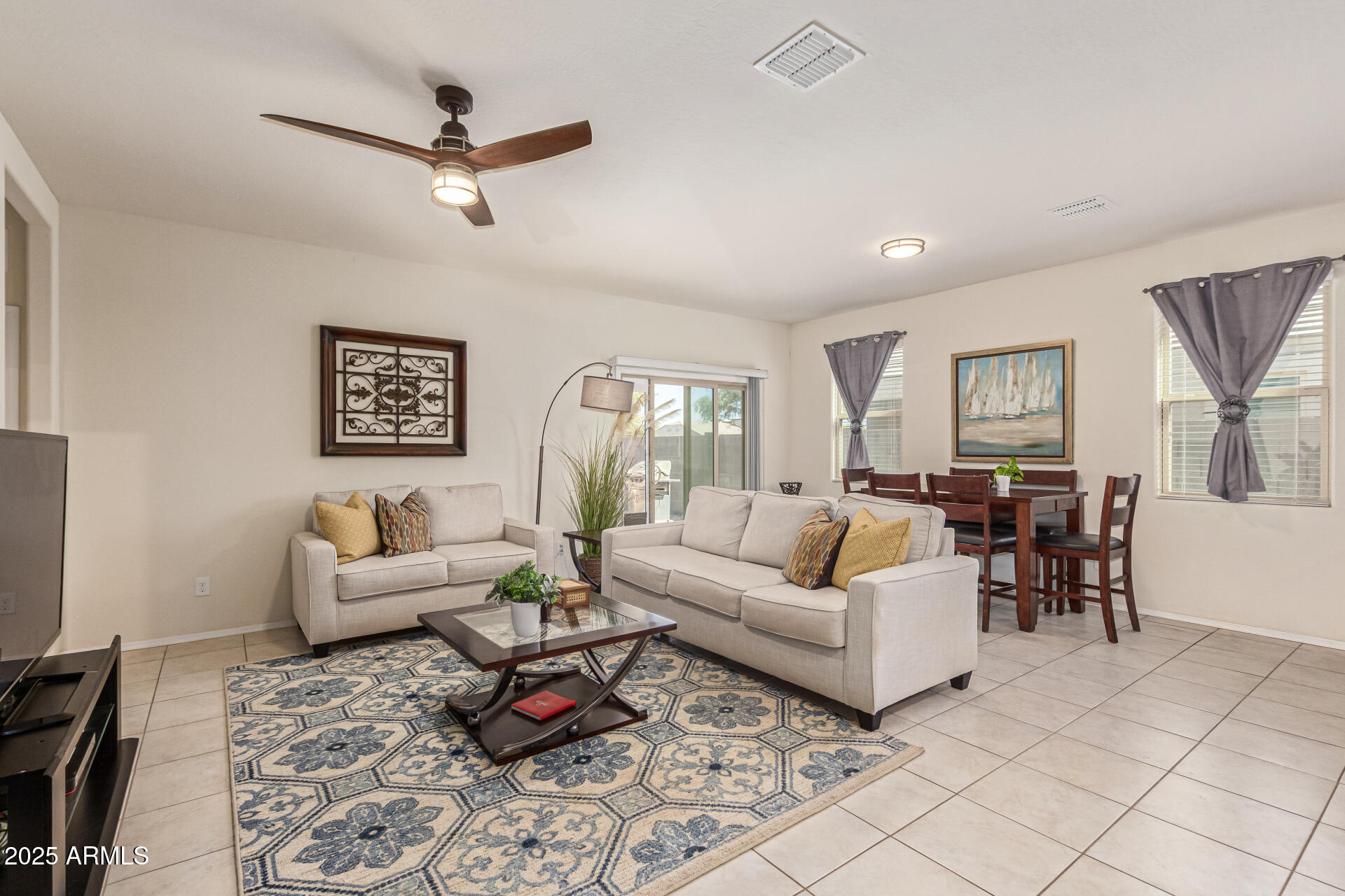 41844 West Rosa Drive Maricopa, AZ 85138 - Photo 18 of 47 a living room with furniture and a view of kitchen