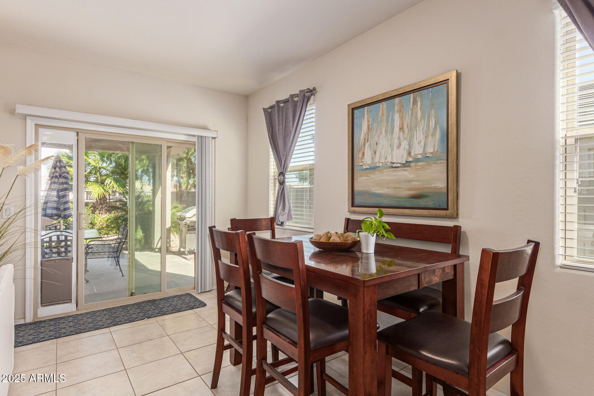 41844 West Rosa Drive Maricopa, AZ 85138 - Photo 20 of 47 a view of a dining room with furniture and wooden floor