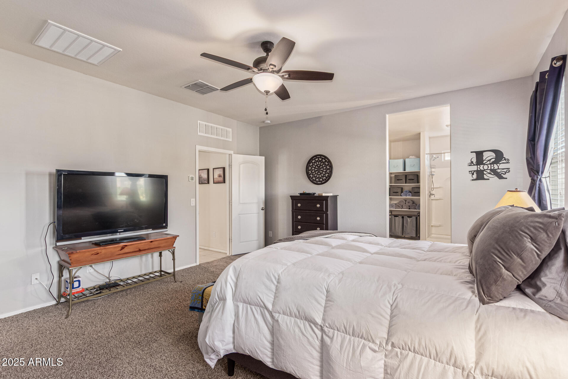 41844 West Rosa Drive Maricopa, AZ 85138 - Photo 26 of 47 a bedroom with a bed and a flat screen tv