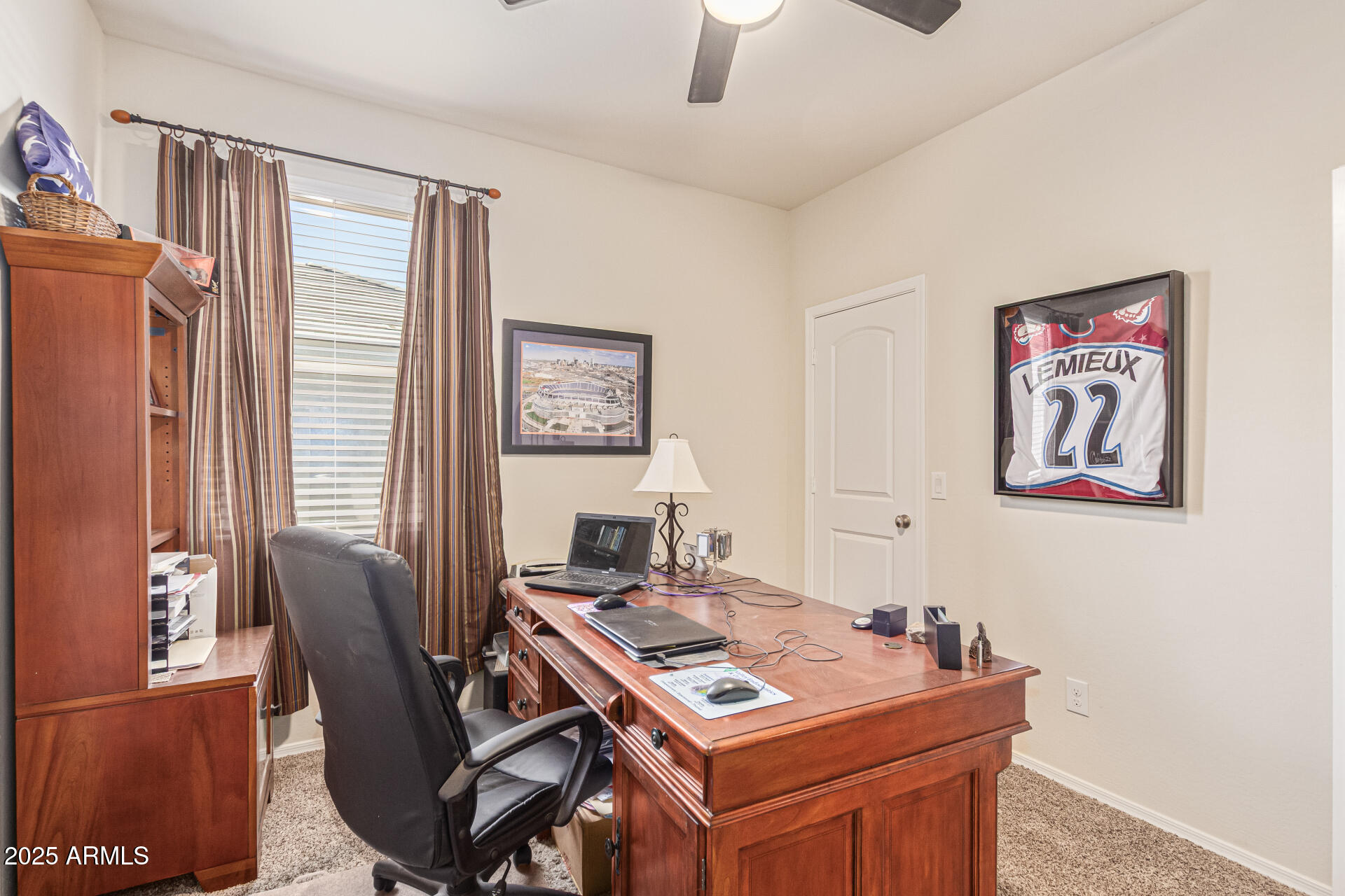 41844 West Rosa Drive Maricopa, AZ 85138 - Photo 29 of 47 a view of a workspace with furniture and a table