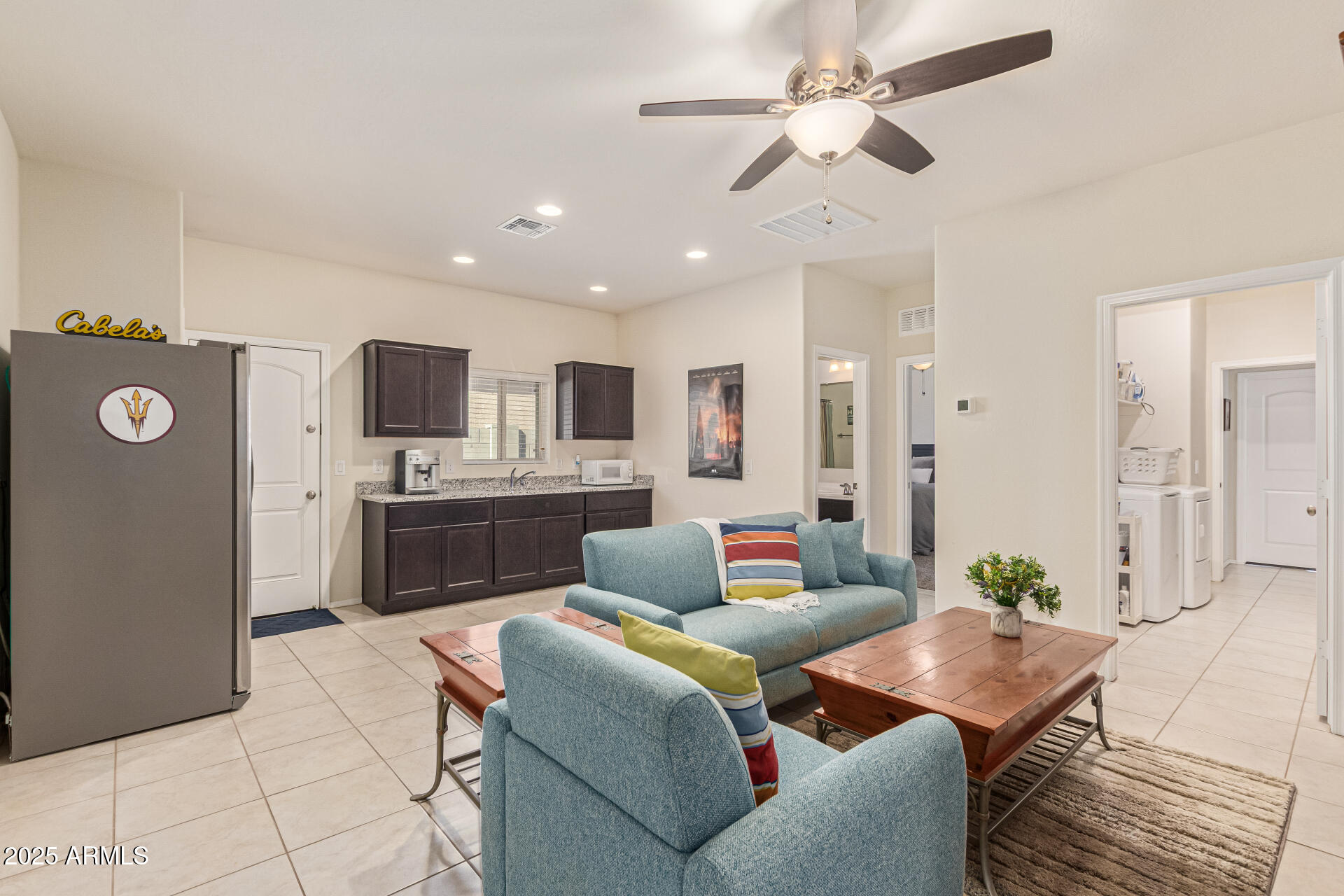 41844 West Rosa Drive Maricopa, AZ 85138 - Photo 30 of 47 a living room with furniture and kitchen view